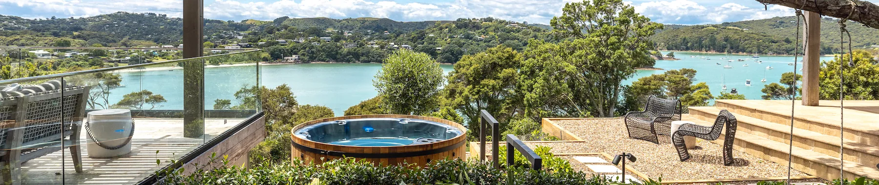 Wide-angle photo of the spa pool with ocean view in background