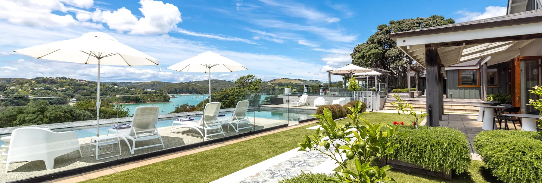 Photo showing the property's front garden and swimming pool