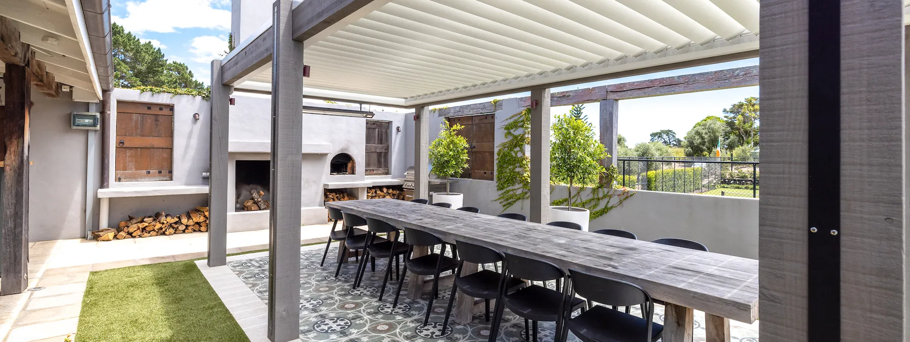 Photo of outdoor dining table looking towards pool area