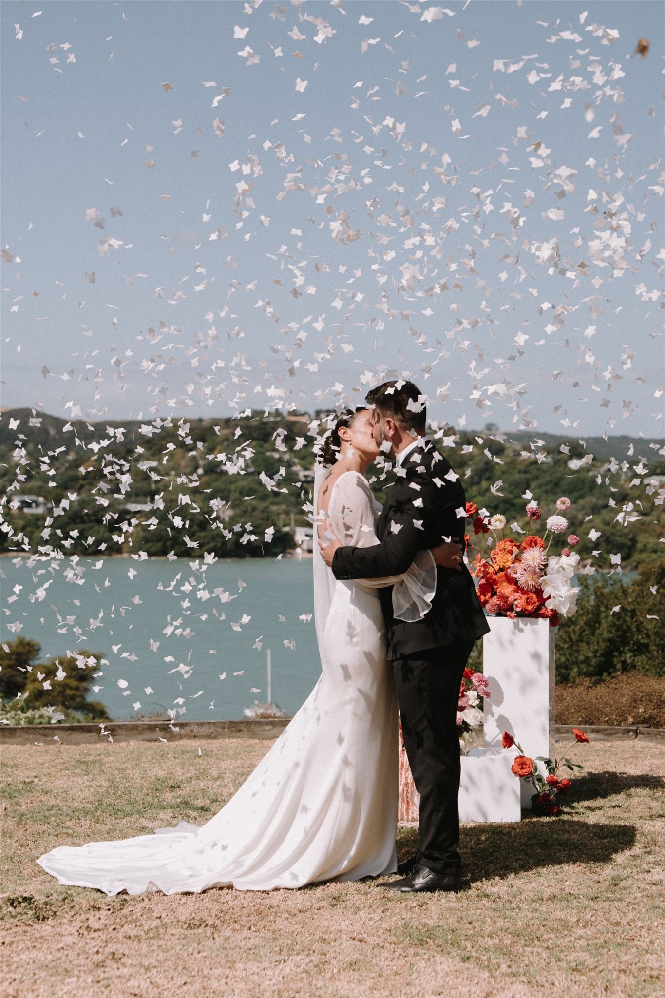 Couple exchanging vows at Putiki Estate, a private Waiheke Island resort